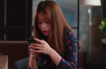 Woman staring at mobile phone